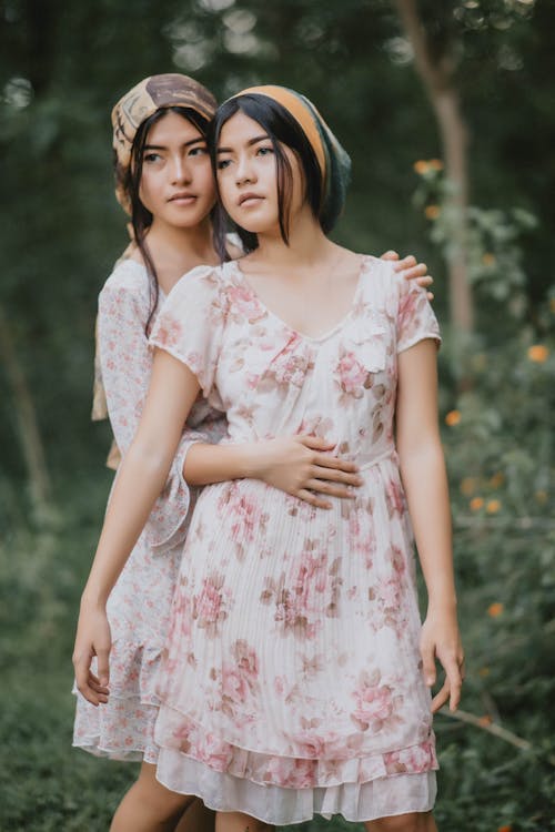 Photo of Two Beautiful Women in Floral Dresses · Free Stock Photo