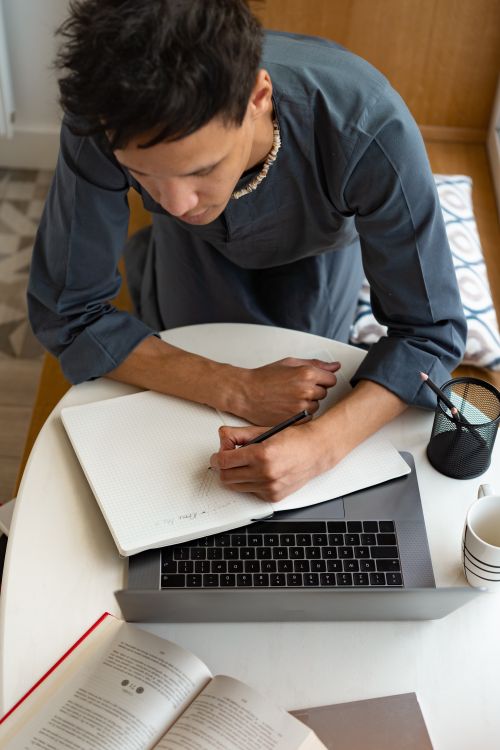 Man Using Weight To Write Man Writing on White Paper · Free Stock Photo