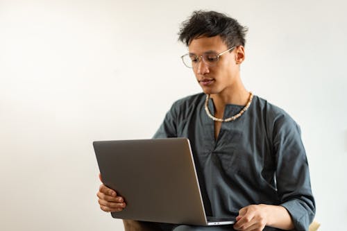 A Man Using a Laptop