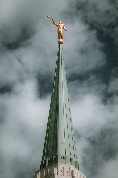 Gray Pointed Roof with Golden Statue