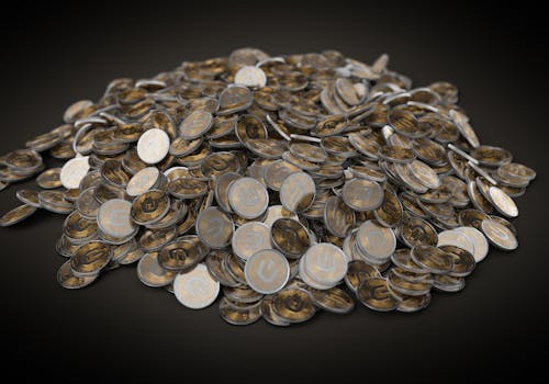 A Pile Silver and Gold Round Coins