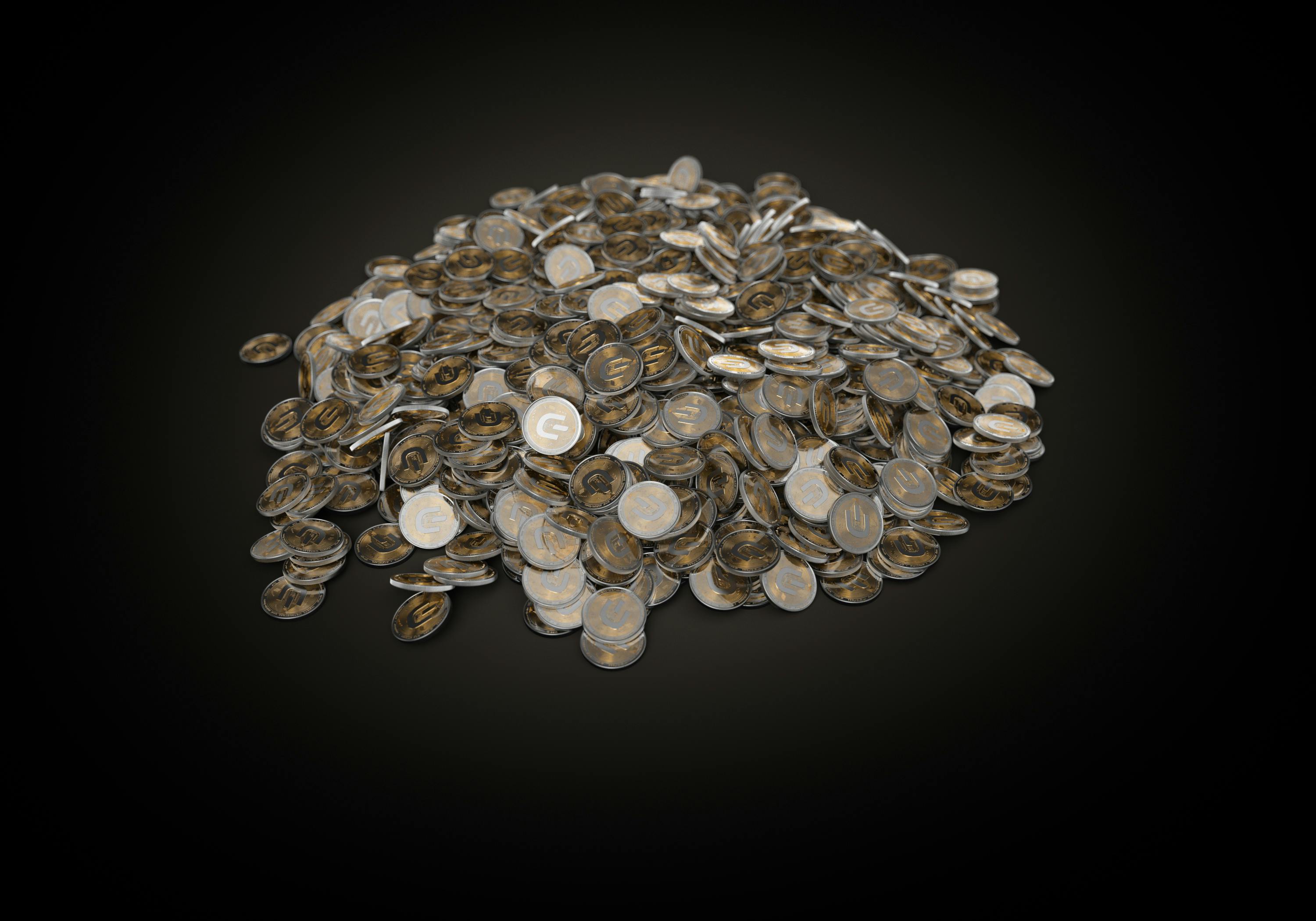 a pile of coins on a black surface