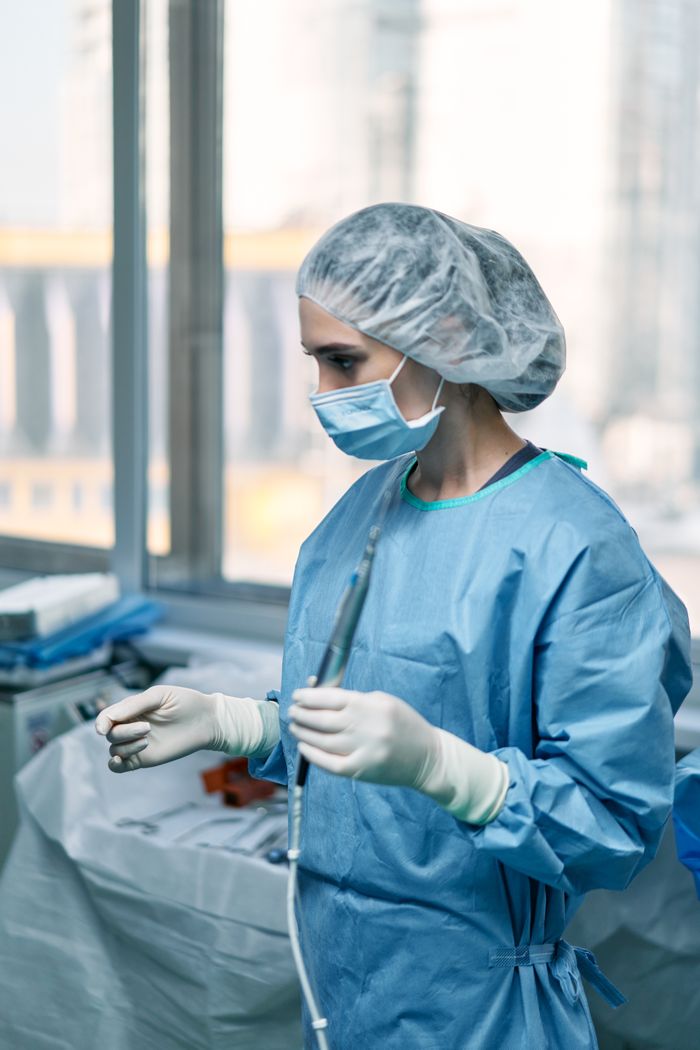 Female surgeon preparing in a hospital operating room