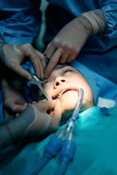 Intricate dental surgery procedure with multiple hands in a hospital setting.