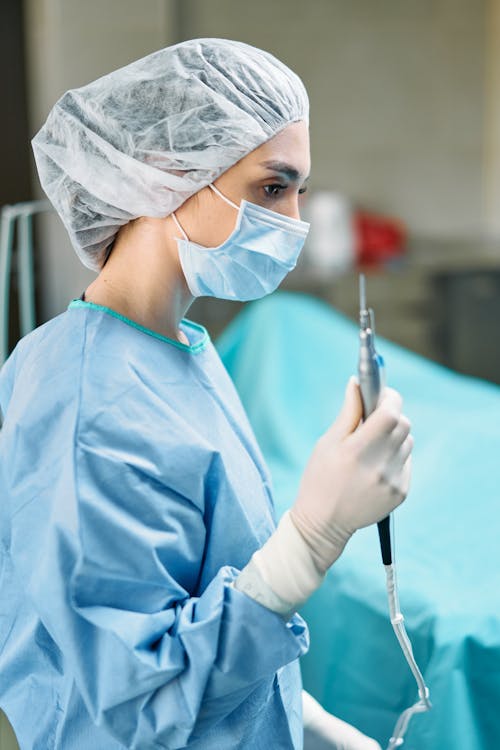A Female Surgeon Holding Medical Equipment