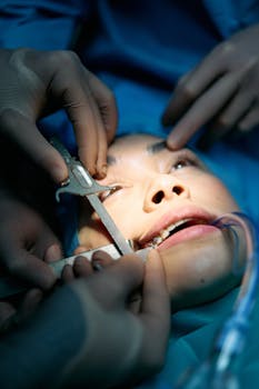 A precise surgical procedure captured in a hospital operating room, highlighting intricate details.