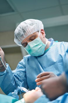 Focused surgeon performing a procedure in a modern operating room with sterile attire.