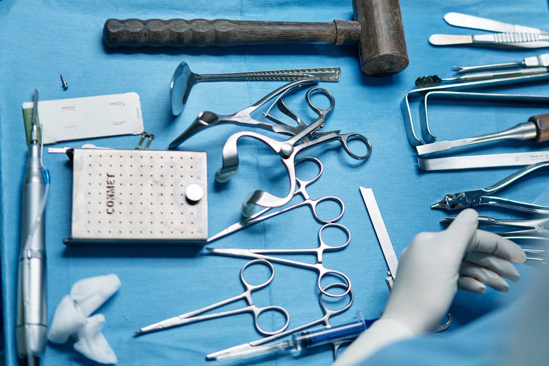 Free Gray Metal Tool on White Table Stock Photo