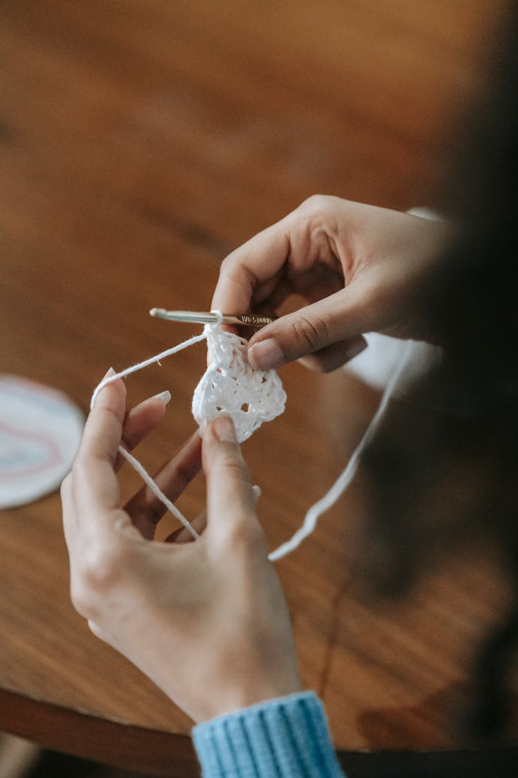 Hands Knitting Using Needles