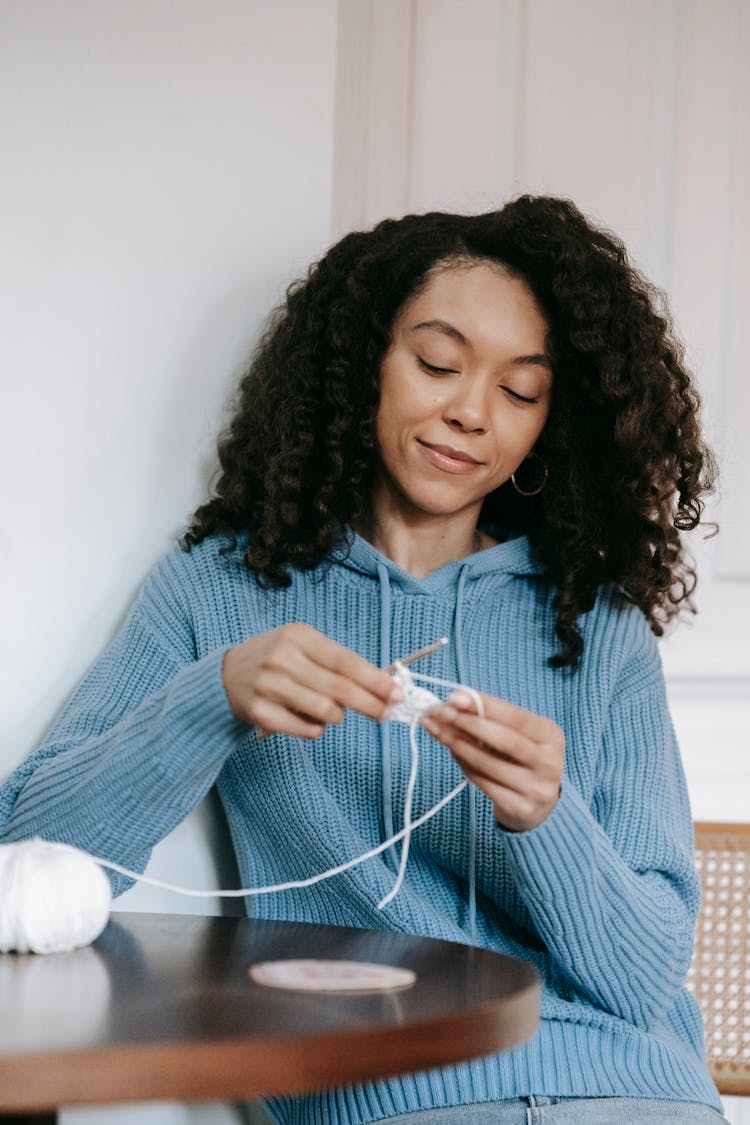 Portrait Of A Knitting Woman