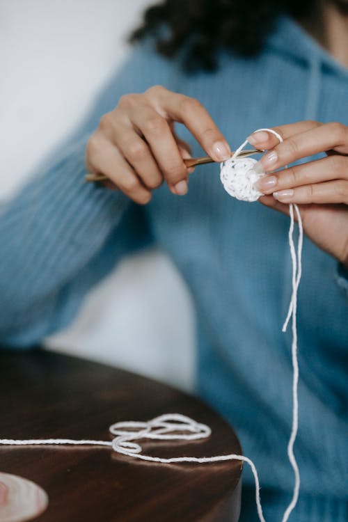 Woman Knitting with Needles