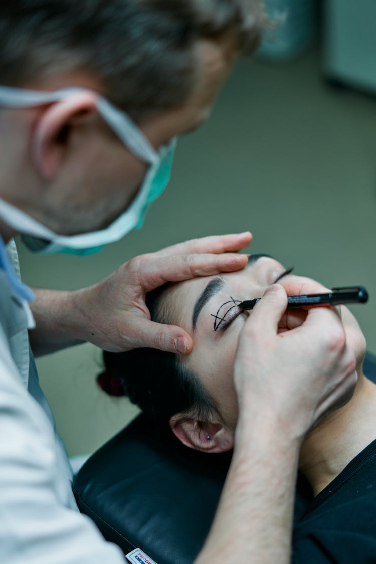 Surgeon Marking A Patient's Eyelid