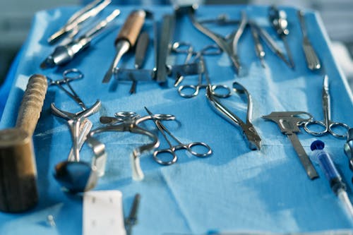 Free Surgical Tools over Blue Surface Stock Photo