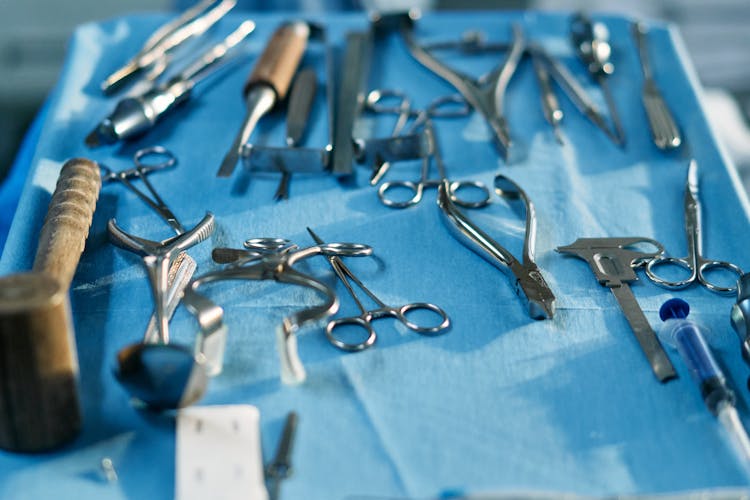 Surgical Tools Over Blue Surface