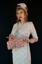 Fashionable woman in vintage outfit with handbag