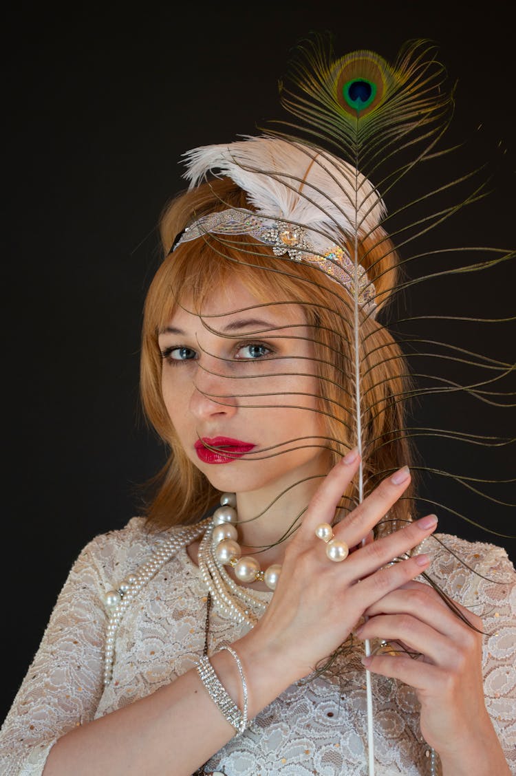 Gorgeous Woman With Peacock Feather