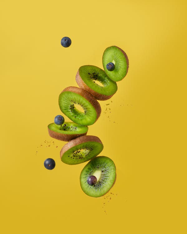 Kiwi Slices and Blueberries in Midair