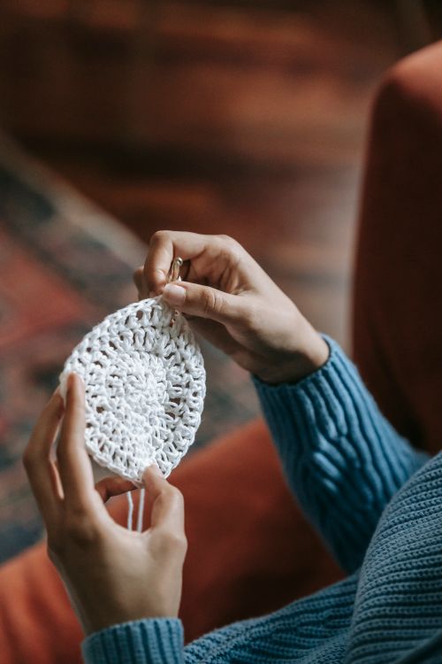 Free Focused on hands crafting a knitted piece, showcasing a hobby indoors. Stock Photo