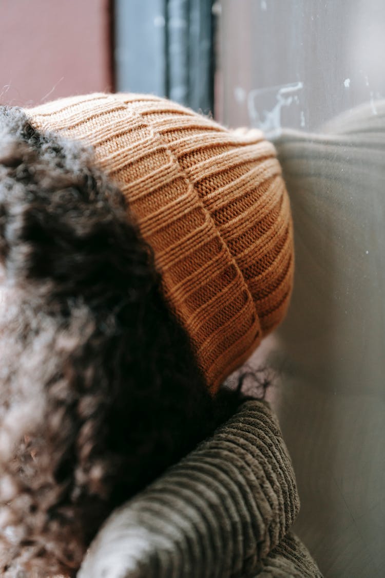 Close-up Of A Woman In A Knit Hat And Warm Clothing