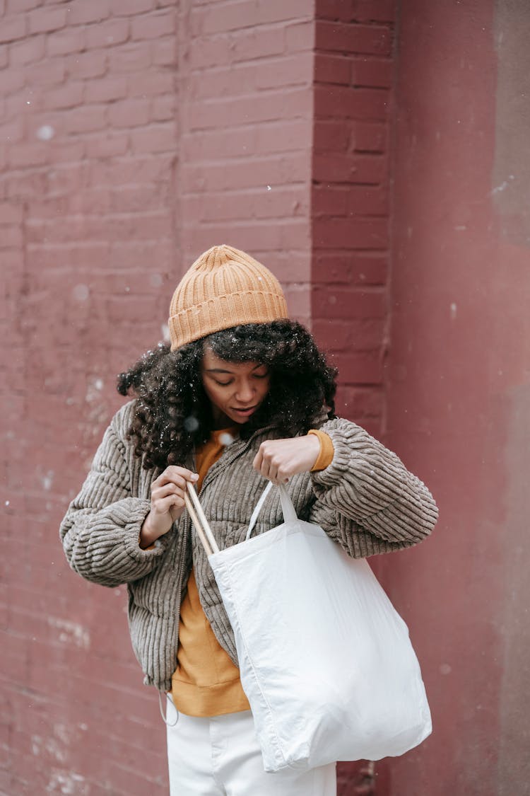 African American Woman With Cotton Bag On Street