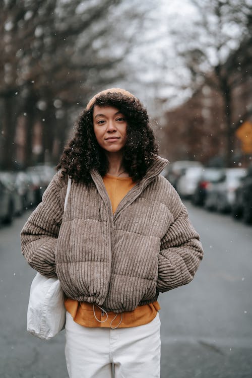 Free Stylish black woman on city road in winter Stock Photo