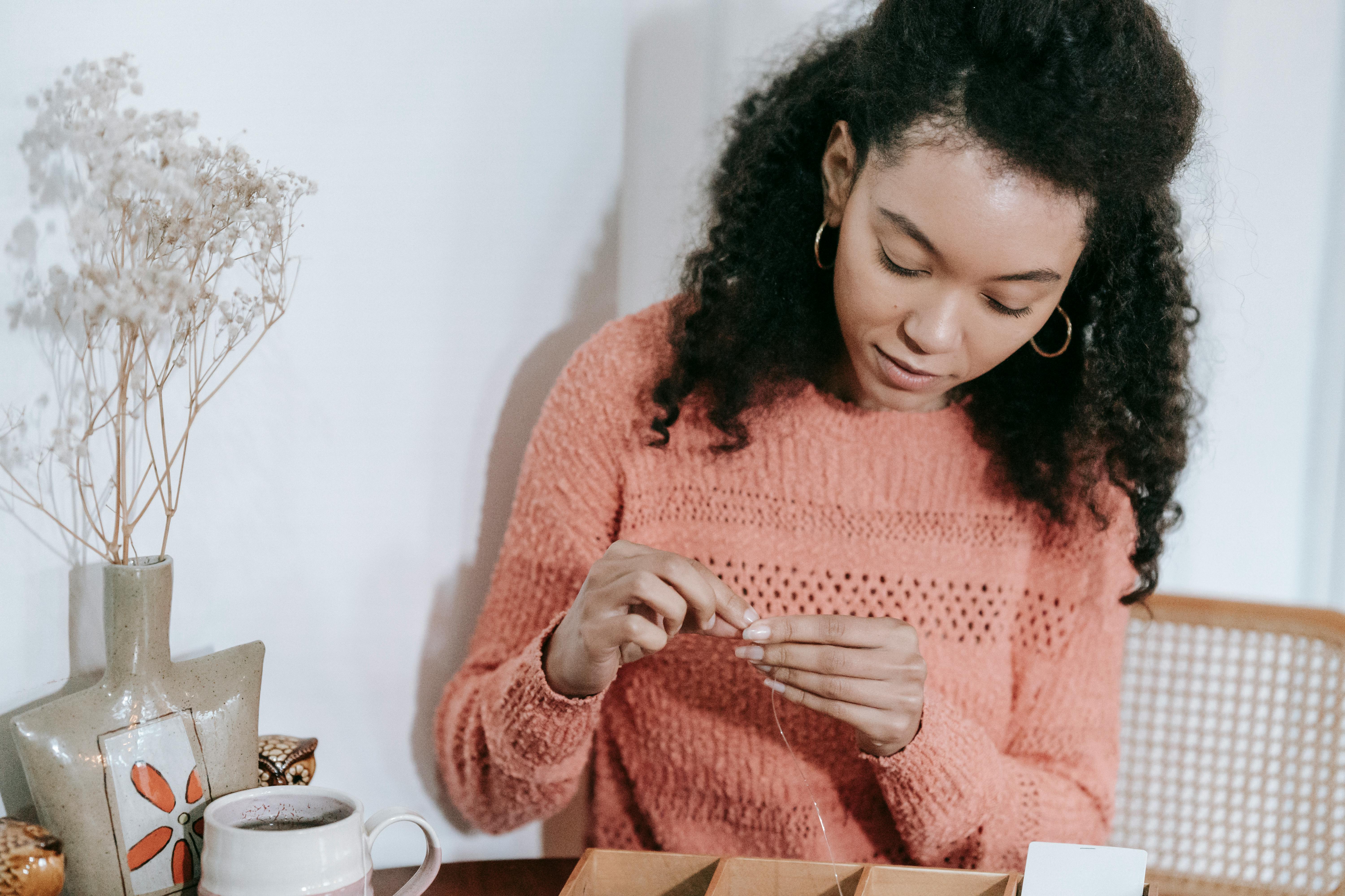 Woman stitches her way through mental health challenges with idea for neurodiversity-themed clothing line — Photo by Miriam A