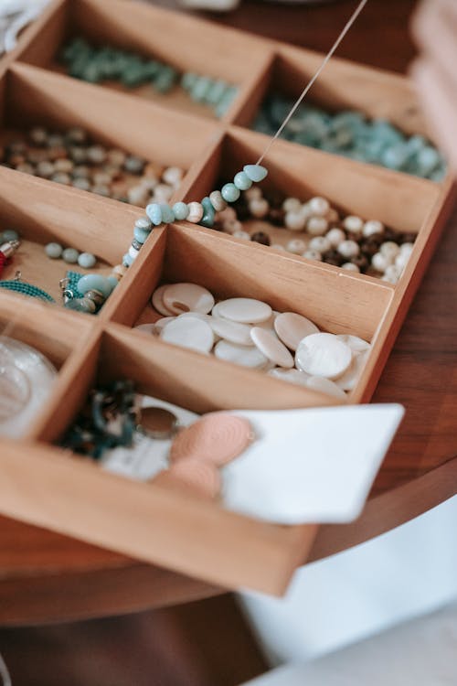 Free Wooden container with various beads Stock Photo