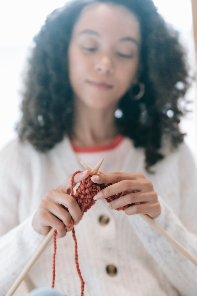 Black Woman Knitting With Threads