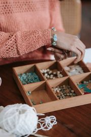 Bead trays on a workbench, photo by Miriam Alonso on Pexels