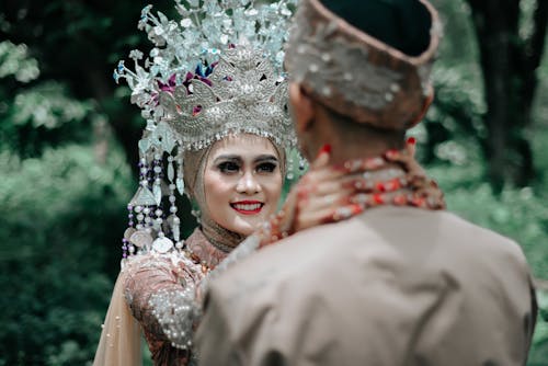 Couple Wearing Traditional Wedding Clothing