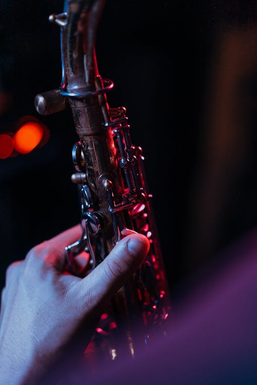 Close-Up Shot of a Person Holding a Saxophone