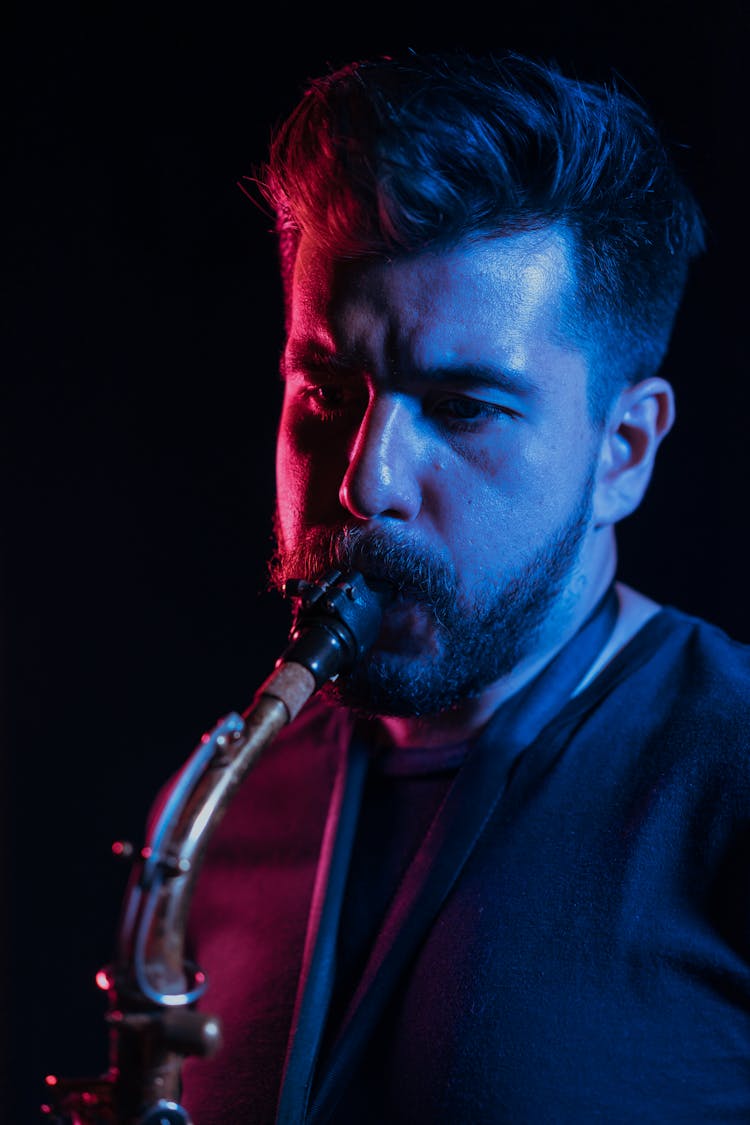 A Man Playing The Saxophone 