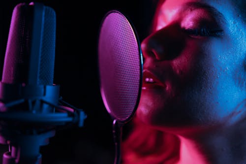 Man Singing in Front of Microphone