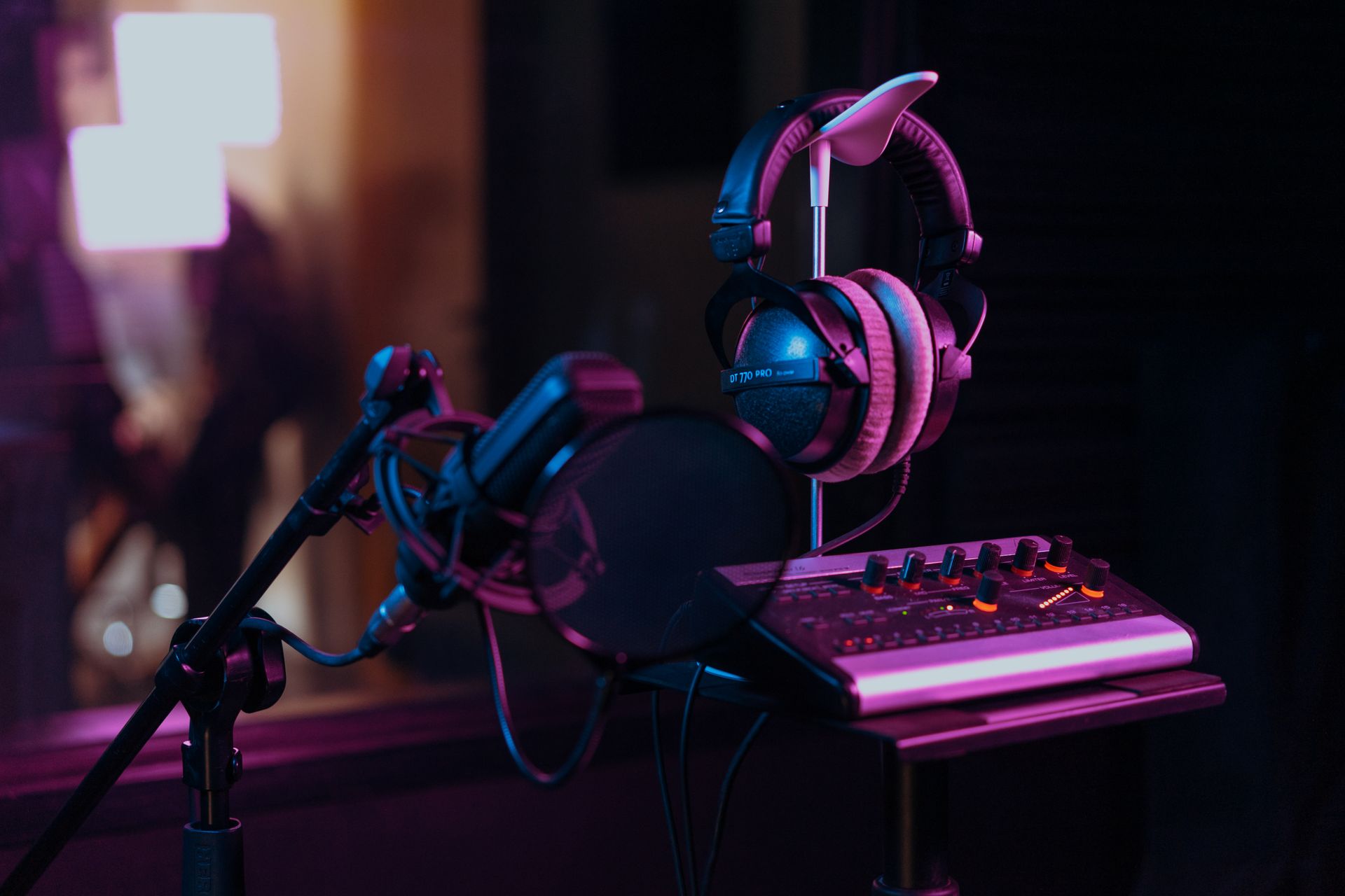 A mixing console and headphones in a music studio