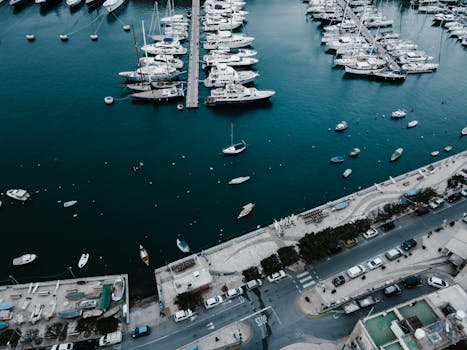 Stunning aerial view of a marina with yachts and boats docked in L-Isla, Malta. Perfect for travel imagery.