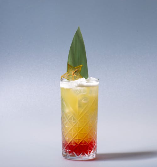 Free A Cocktail Drink on a Clear Glass with Green Leaf Stock Photo