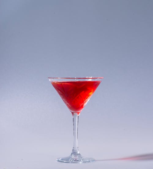 Close-Up Photo of a Red Drink in a Cocktail Glass