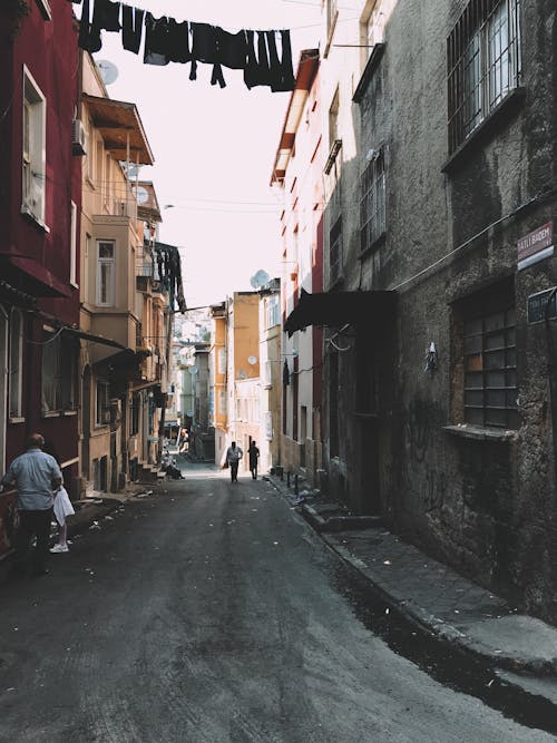 Free Narrow street with aged buildings Stock Photo