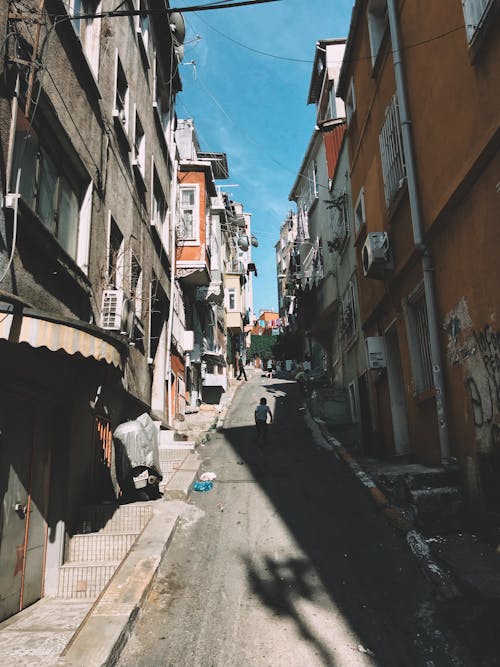 Narrow street between aged houses