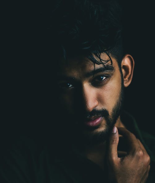 Portrait of a Handsome Man with Facial Hair Looking at the Camera