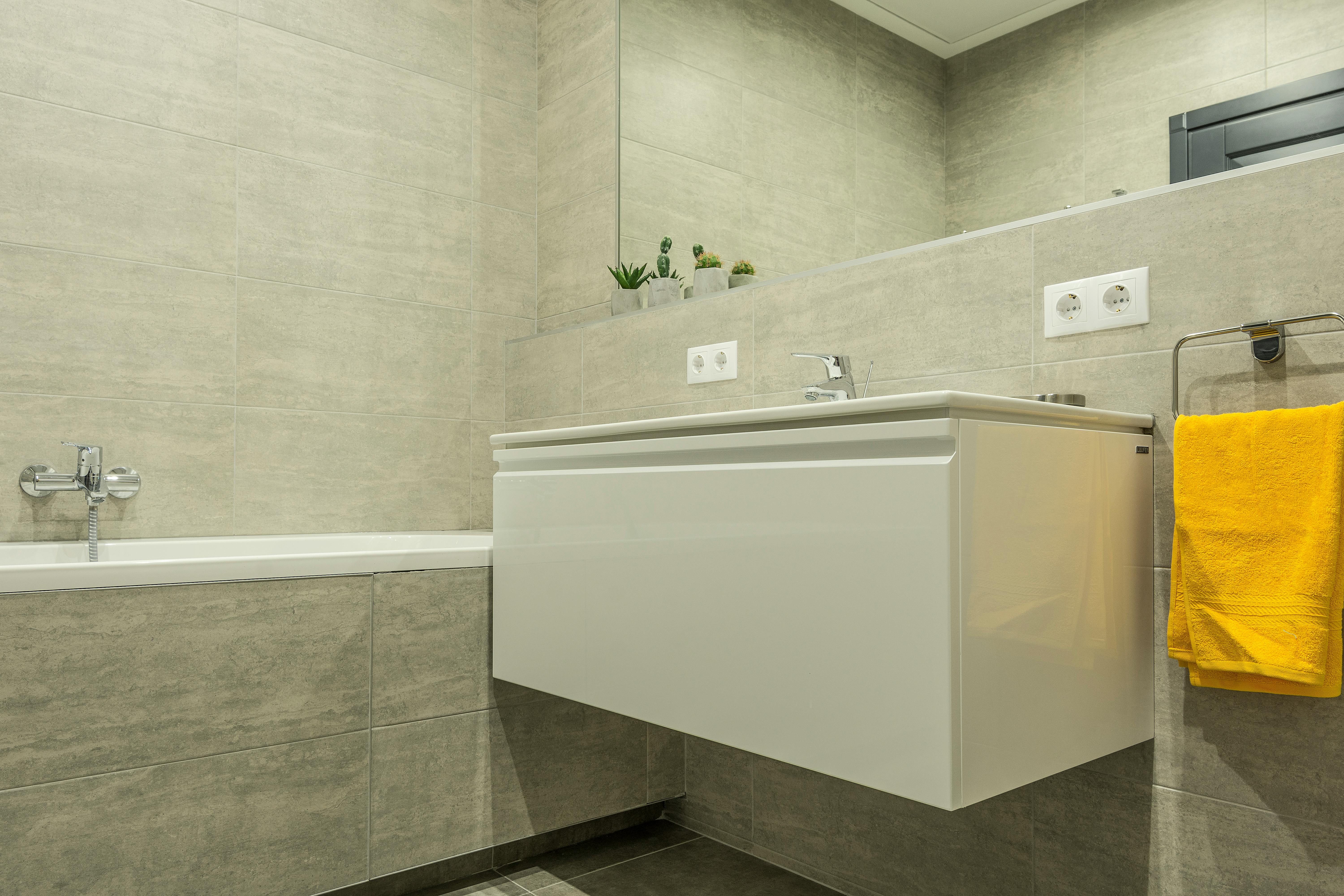 white vanity and mirror in a bathroom