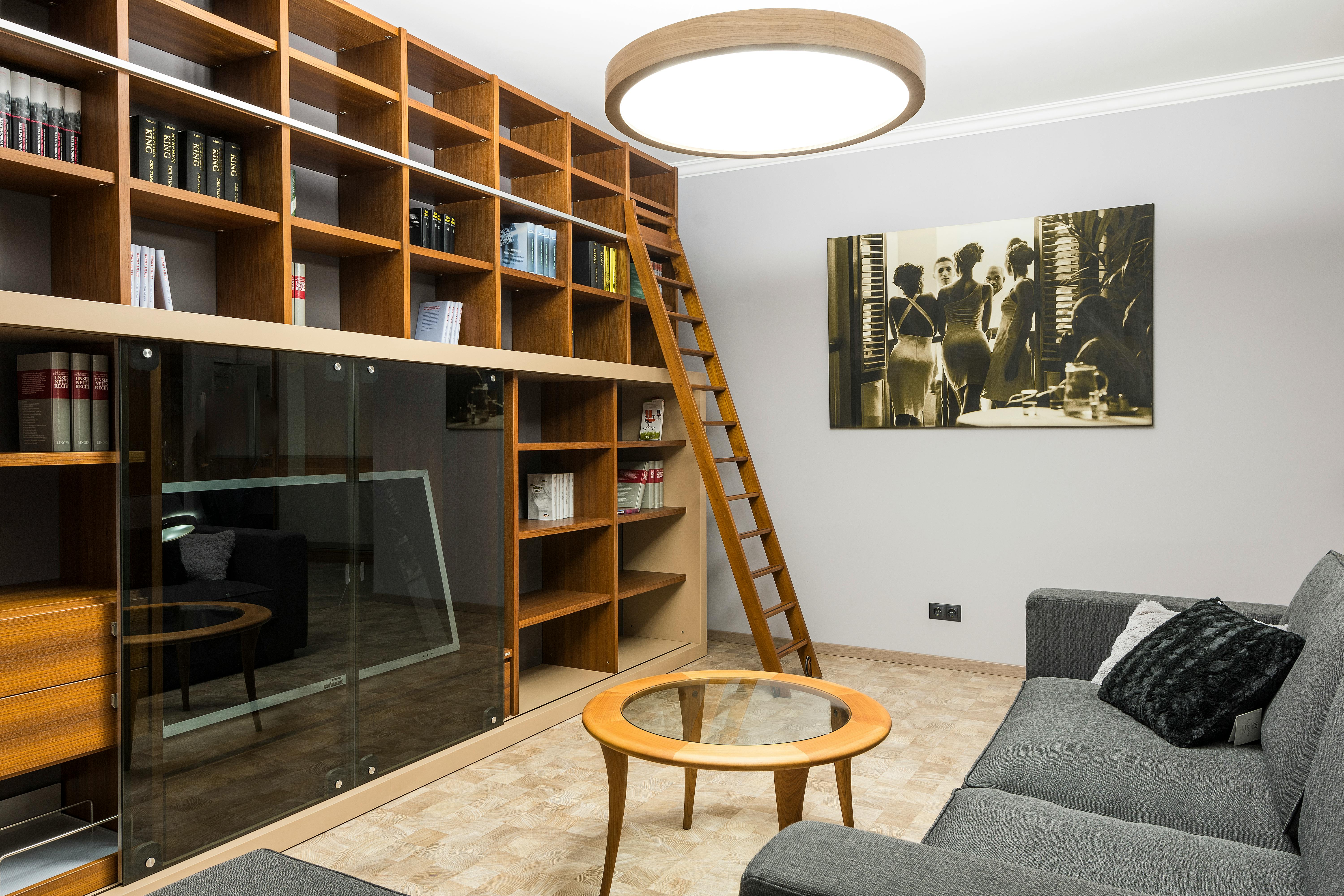 flat screen television in wooden bookshelves