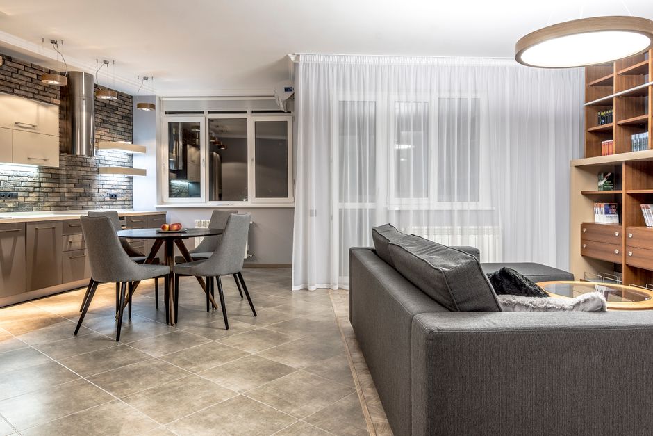 Photo by Max Vakhtbovych on Pexels Elegant open-concept living room and kitchen with contemporary decor, emphasizing comfort and style. - Photo by Max Vakhtbovych on Pexels