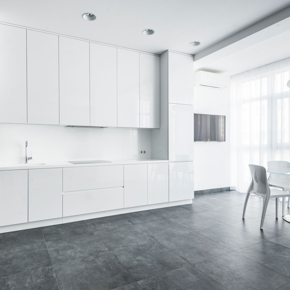 Kitchen Spraying in Waddon — a decorator at work mid-project