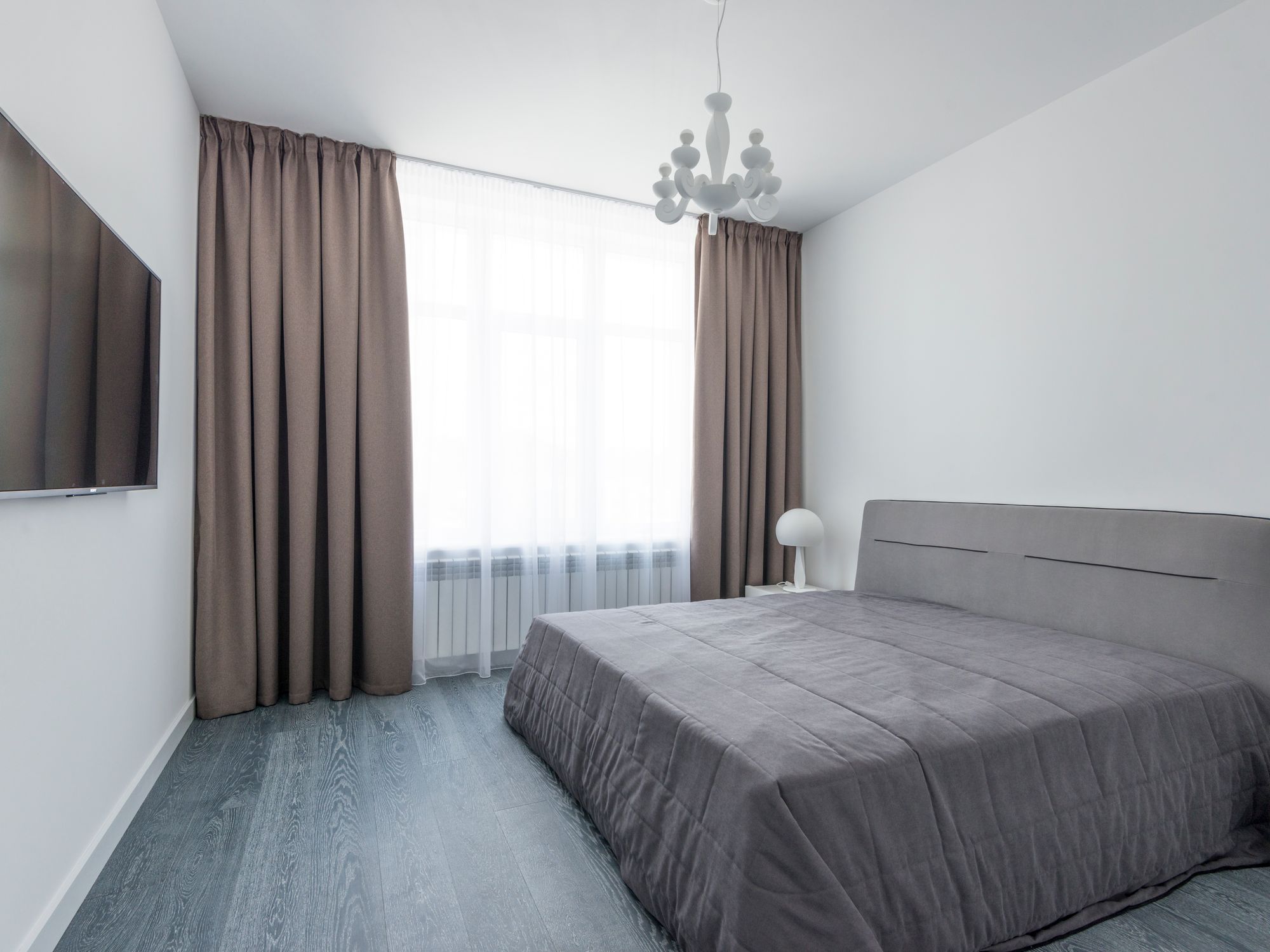 House Removals in Geddington, East Midlands — professional movers carrying furniture on a house move