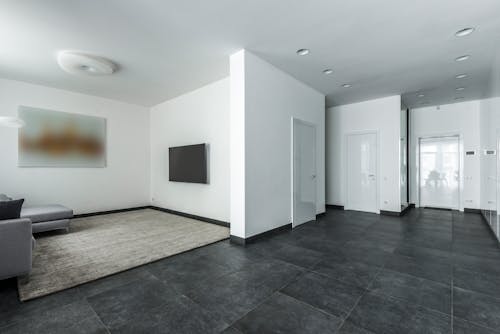 Open Plan Living With Floor Tiles and White Walls
