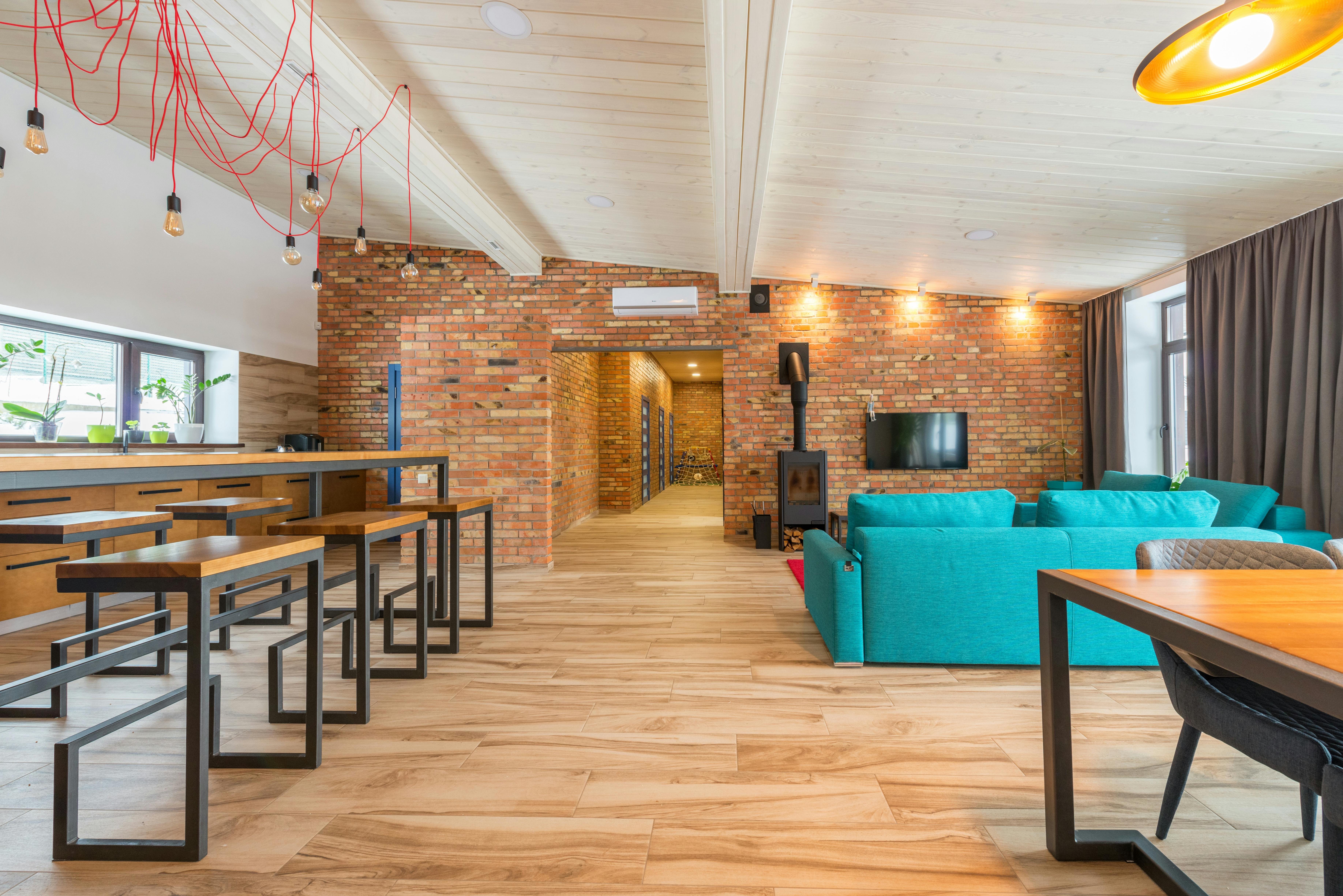 stylish loft apartment interior with exposed brick and large windows - Chicago apartment rentals