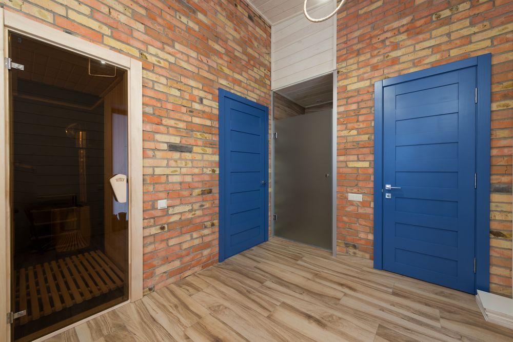 Custom blue door and brick wall