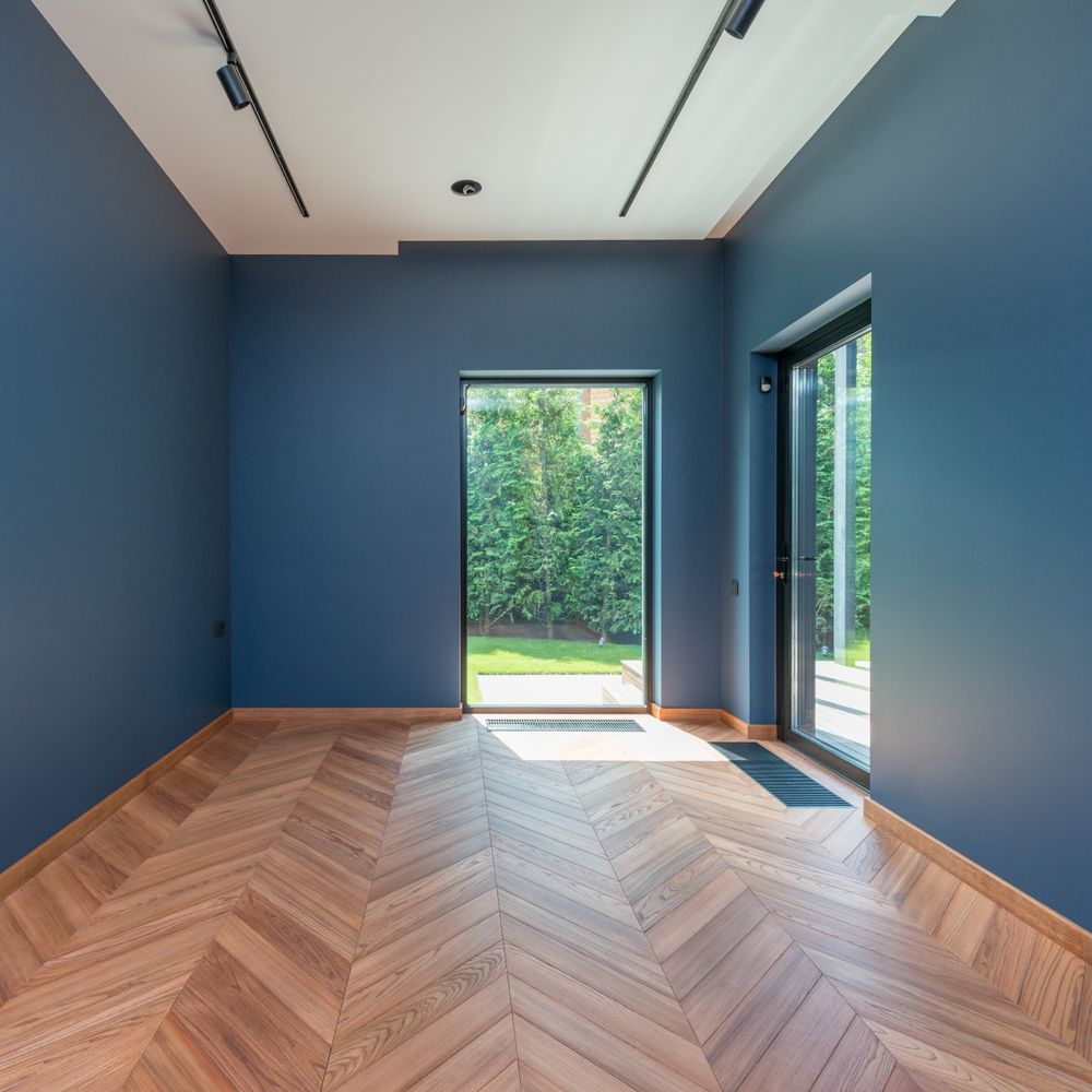 Masonry and Render Painting in Heston — quality trade paint going on in two coats