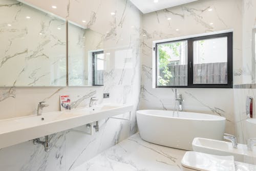 A White Bathtub and Sink in the Bathroom